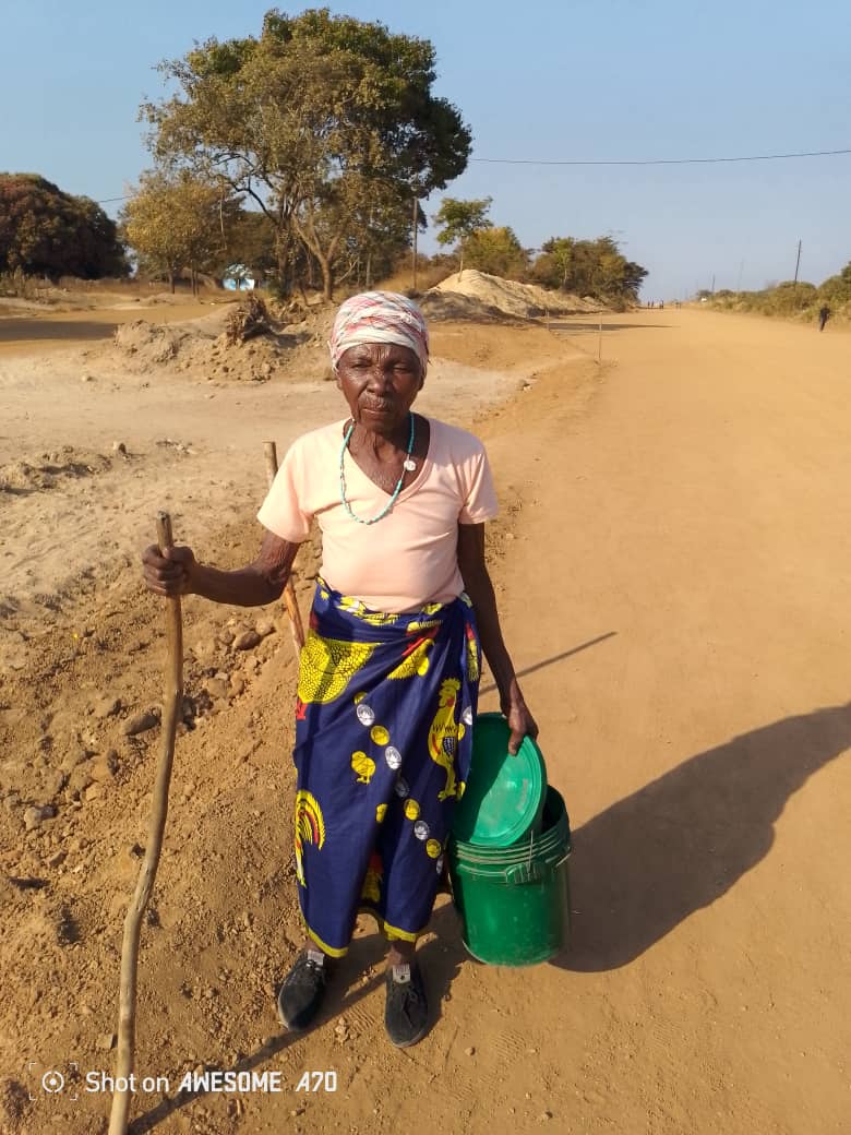 An elderly woman in Kabwata receiving support